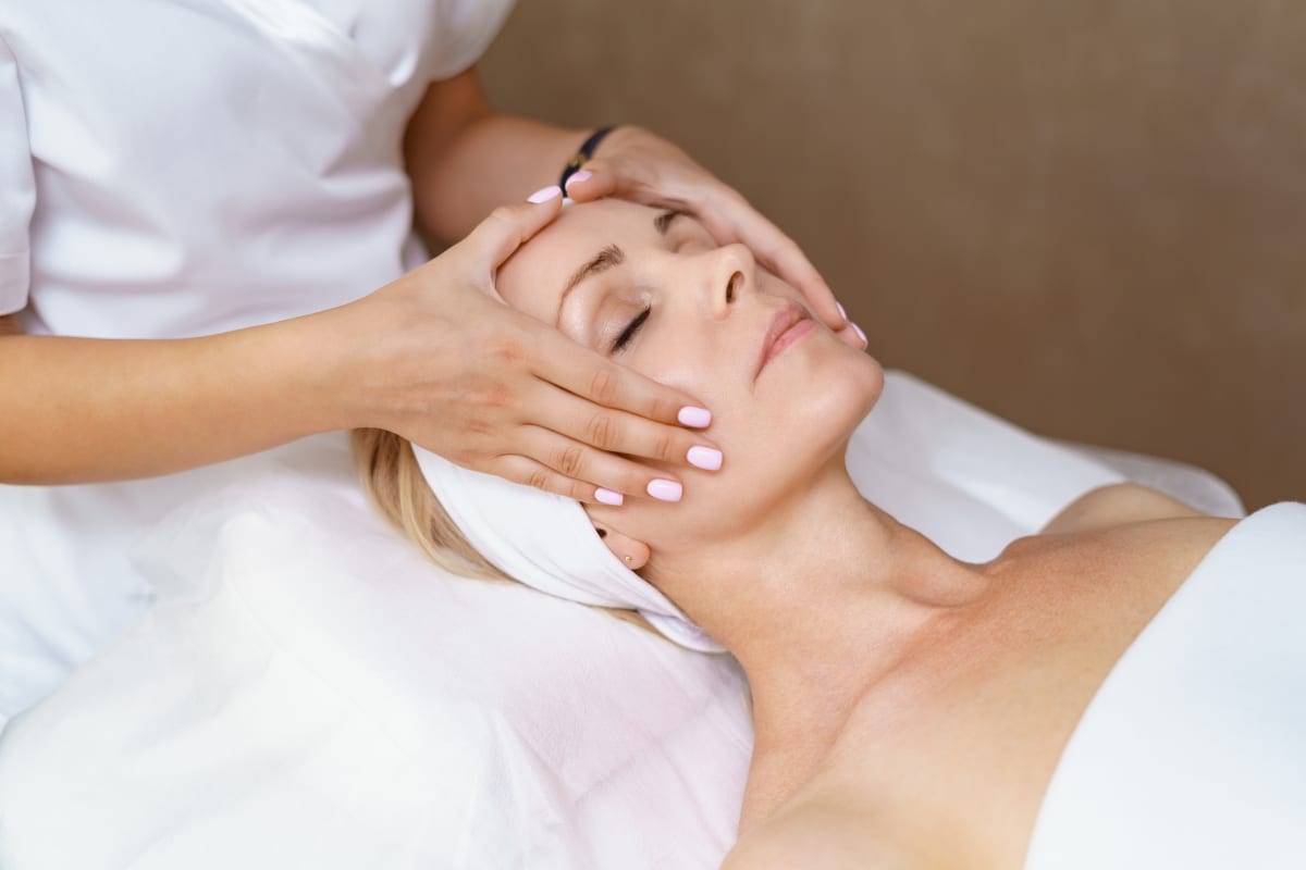 Guest enjoying The Knotstop Signature Facial in San Diego.