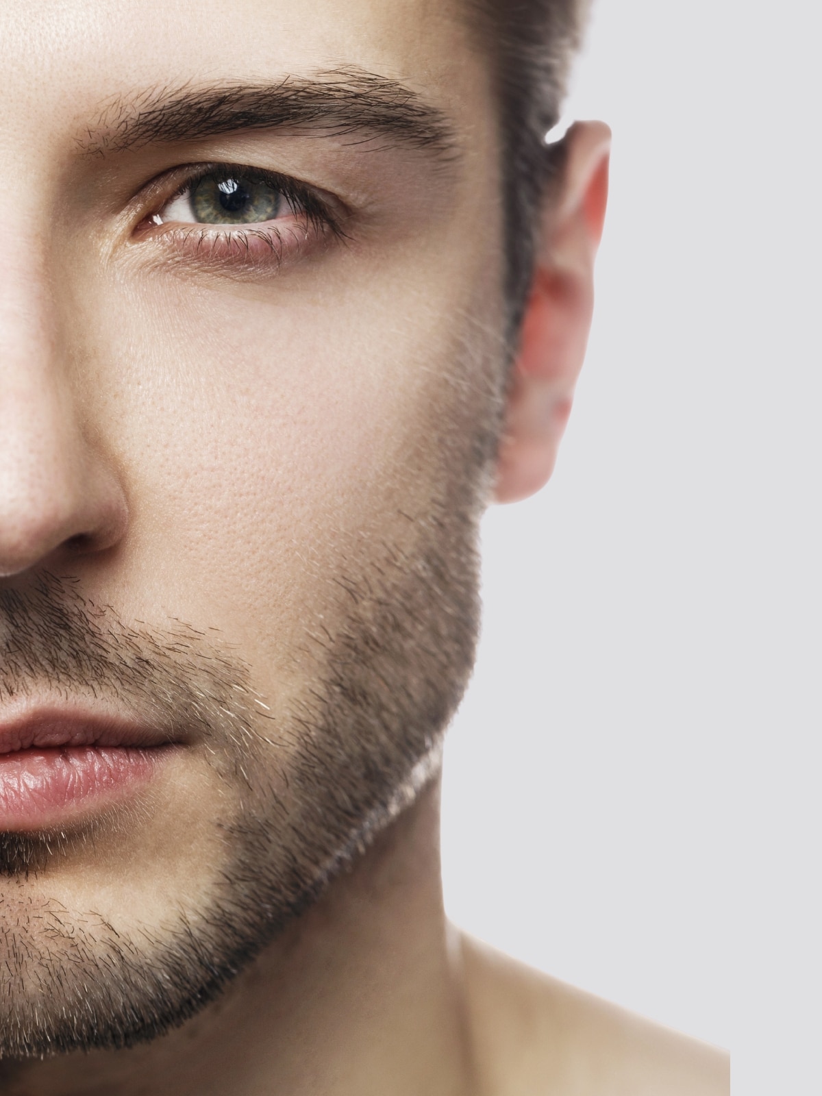 Man receiving a professional facial treatment at The Knotstop.