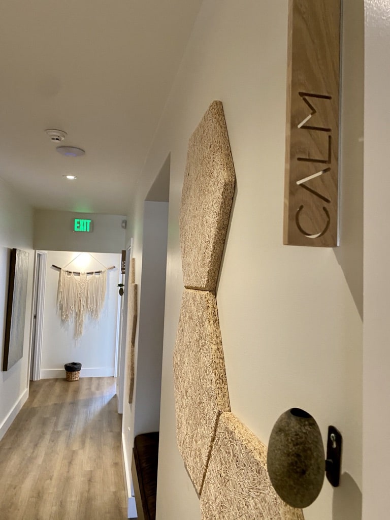 Hallway leading to private massage and skincare treatment rooms at The Knotstop in San Diego's Bankers Hill neighborhood.